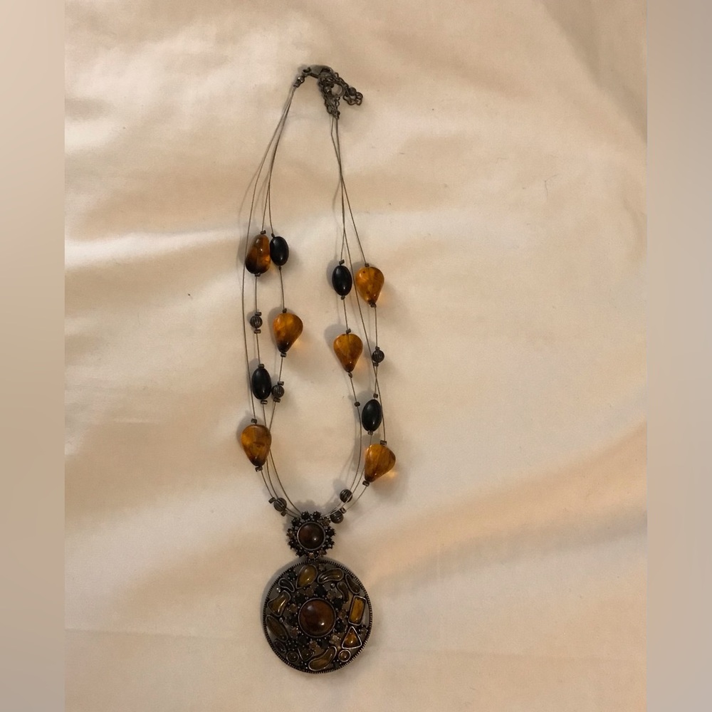 Necklace with brown and black gems